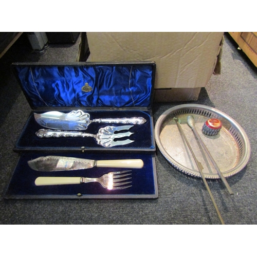 1560 - A box of various metal wares including silver plated chamber sticks, cutlery etc.