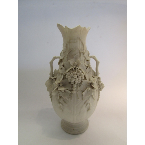 1591 - A twin handled baluster form vase applied with fruiting vines, rim A/F, 30cm tall