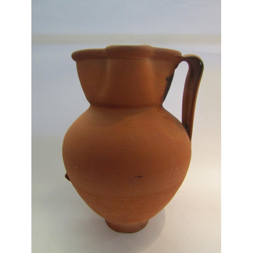 1609 - A large terracotta jug with handle, 40cm tall