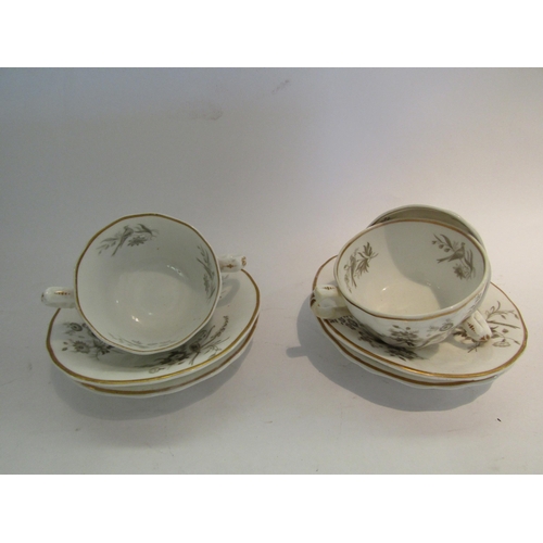 1611 - A set of four Victorian cups and saucers, white ground painted with birds in foliage, gilt bands