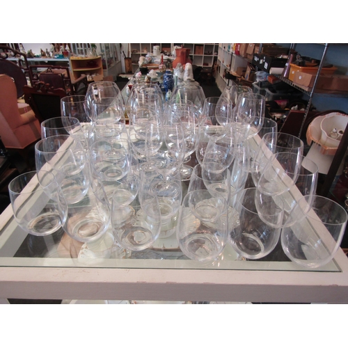 1653 - A suite of thirty clear glass drinking glasses to include brandy, wine and water