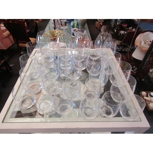 1653 - A suite of thirty clear glass drinking glasses to include brandy, wine and water