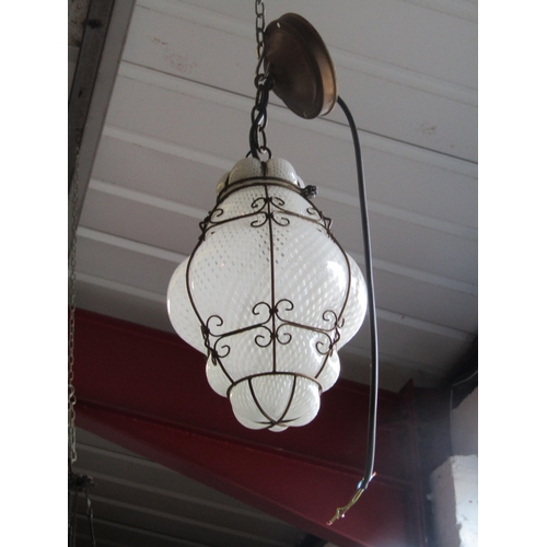 1660 - A Murano latticino ceiling lantern with metal caged surround, 32cm high, crack to glass