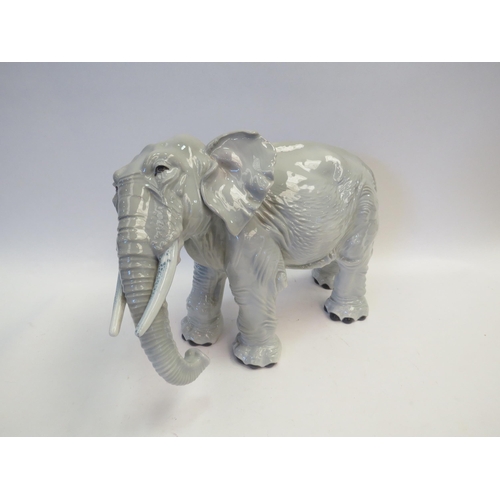 1102 - A large Copenhagen style porcelain elephant, 21.5cm tall