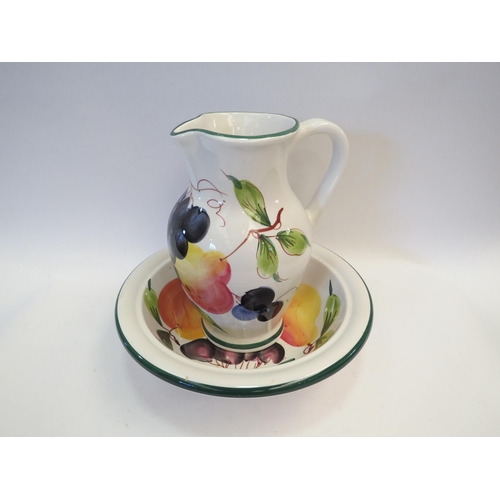 1340 - An Italian jug and bowl over-painted with fruit