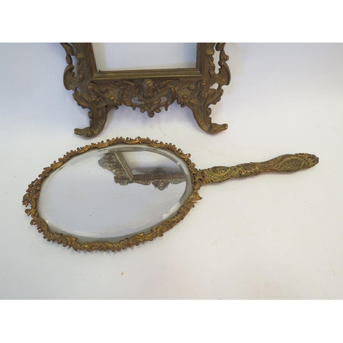 1344 - A gilt brass classical picture frame together with a similar hand mirror (2)