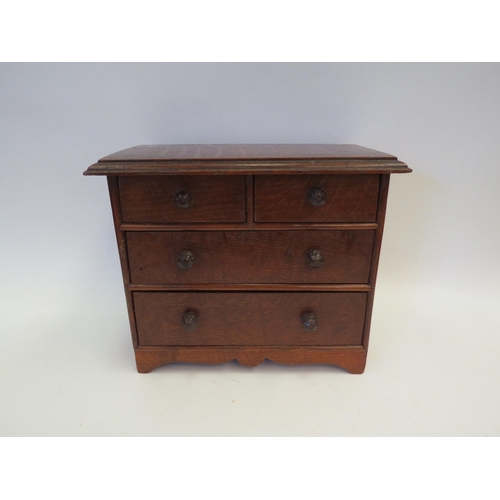 1356 - A small Victorian oak apprentice chest, two short over two long drawers, 21cm tall x 25cm wide x 12c... 