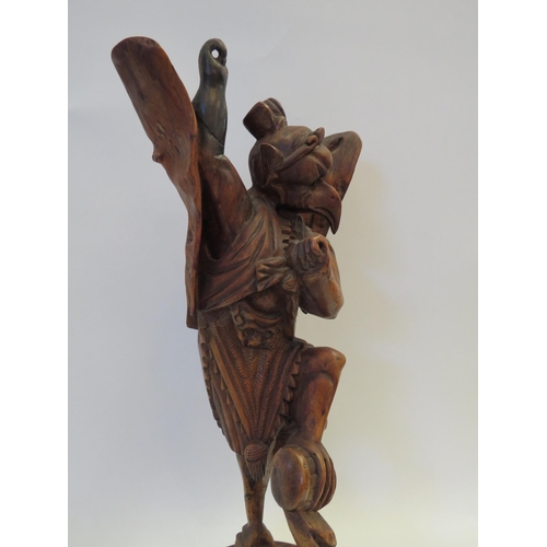 1357 - A 19th Century Oriental carved wooden figure of deity (restored), 40cm tall