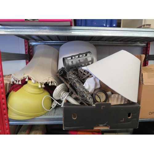 1378 - A box containing lamp shades, lace, throw, place mats, coasters, ceramics, tins etc.