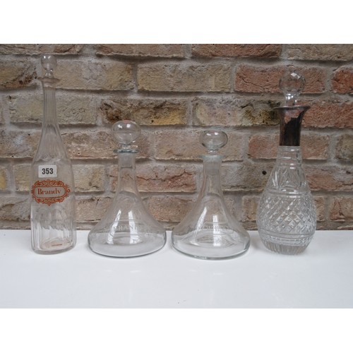 6108 - A pair of ships decanters etched with fruiting vines, 'Whisky' and 'Brandy' and two others (4)