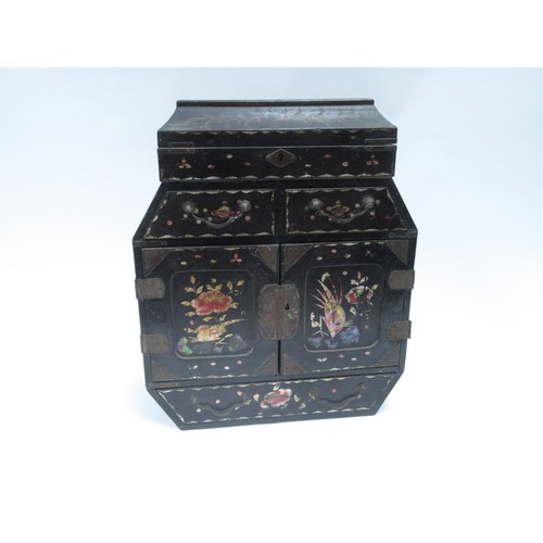 6253 - An Oriental black lacquer jewellery table top cabinet with rising top twin doors, six drawers, and p... 