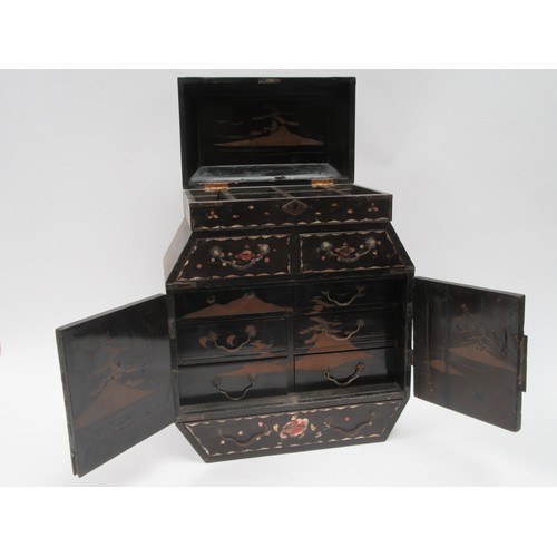 6253 - An Oriental black lacquer jewellery table top cabinet with rising top twin doors, six drawers, and p... 