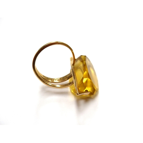 6336 - MARGARET DE PATTA: (1903-1964) An abstract 14k gold ring set with a large three sided facet cut citr... 