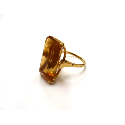 6337 - A large emerald cut citrine 2.5cm x 1.5cm ring on unmarked gold ring shank. Size U