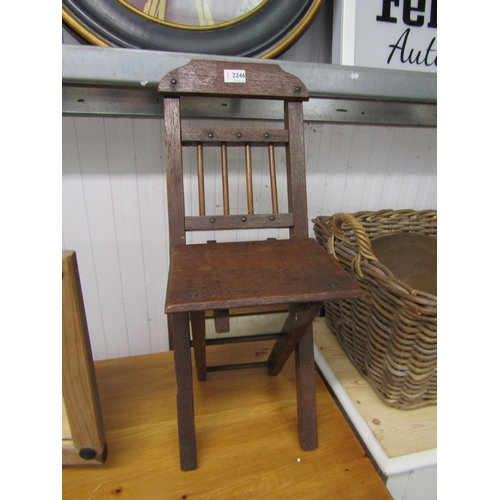 2210 - An Edwardian oak childs folding chair