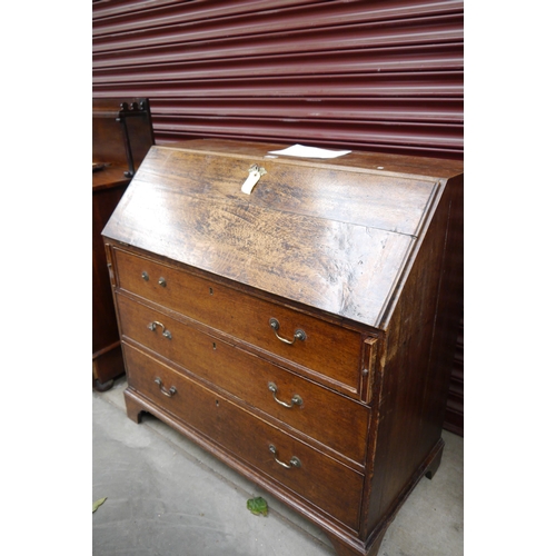 2124 - A Georgian oak bureau, back a/f