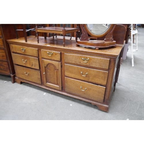 2158 - A Georgian oak sideboard dresser base