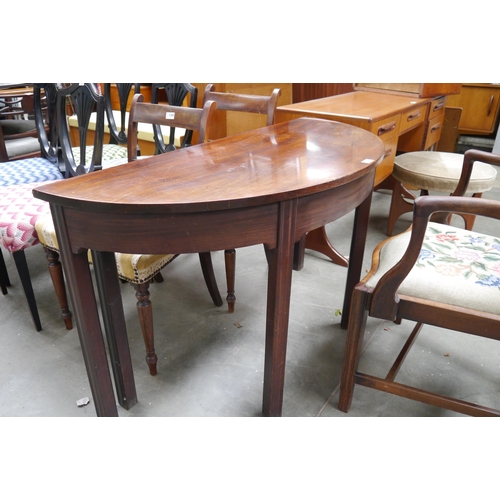 2140 - A Georgian mahogany demi-lune table