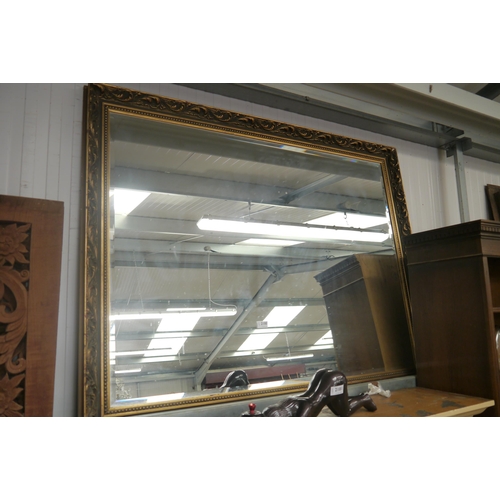 2181 - A large gilt framed mirror with bevelled edge glass 105cm x 130cm