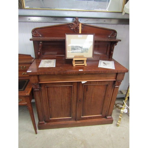 2182 - A Victorian mahogany chiffonier, the raised shelved back over a frieze drawer and two door cupboard,... 