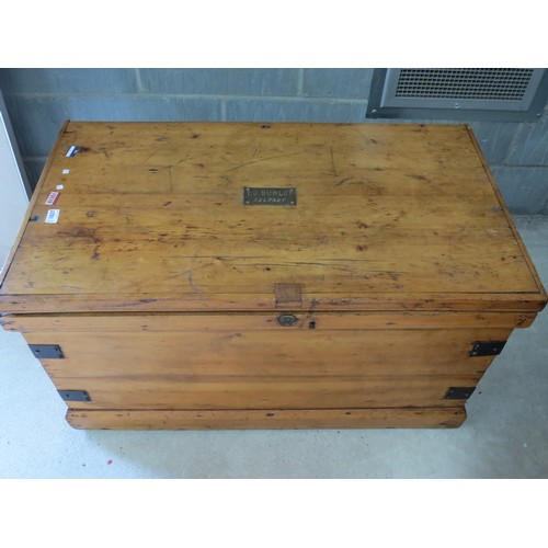 1027 - A pine metal-bound trunk, brass plate to top, 'T. J. Dunlop Belfast'. 99x55x55cm