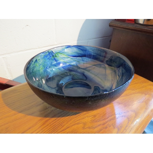 1110 - A blue and green Art Glass bowl, 25cm diameter