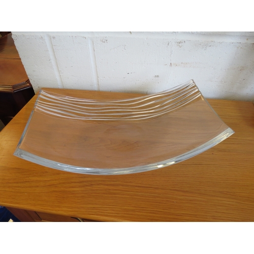 1126 - A crystal bowl of elongated curved form with line detail, 36cm long