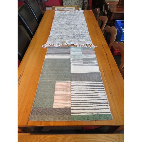 1257 - Two cotton rugs, 128cm x 60cm and 90cm x 56cm