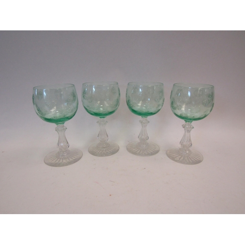 1512 - A set of four Victorian green cut wine glasses