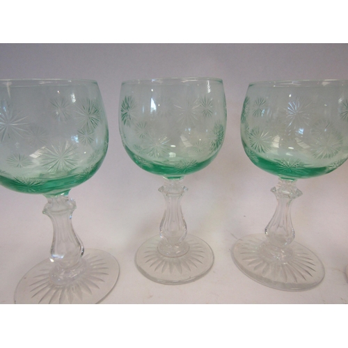 1512 - A set of four Victorian green cut wine glasses