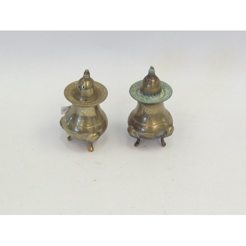 1044 - A pair of salt and pepper pots, 9cm tall.