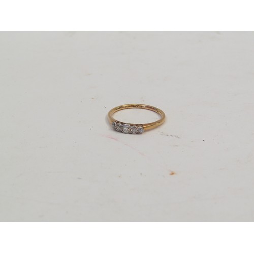 1065 - A five stone graduated diamond ring, stamped 18ct, size Q, 2.3g