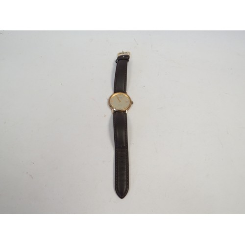 1071 - A 9ct gold cased Accurist wristwatch with brown leather strap