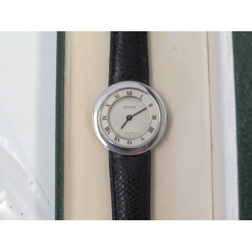 1085 - A Gucci stainless steel wristwatch, model No. 545P. Boxed with booklet.