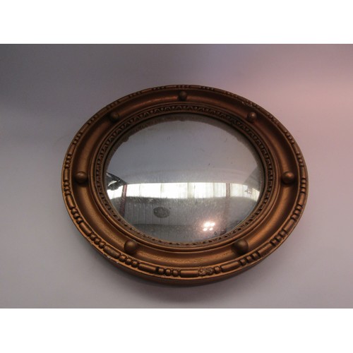 1605 - A gilded convex wall mirror with ball detail, 40cm diameter