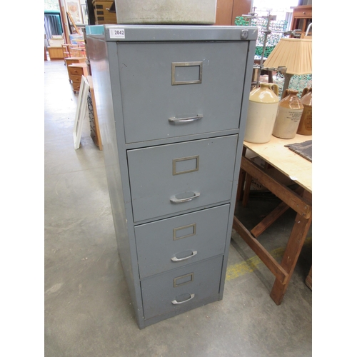 2042 - A four drawer metal filing cabinet