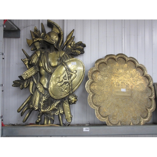 2069 - A brass scalloped edge tray table top together with an armour wall plaque (2)