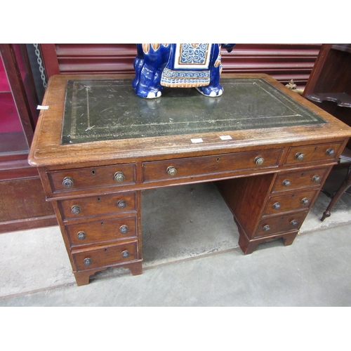 2083 - A late Victorian oak nine drawer twin pedestal desk, leather inset top, 73cm x 120cm x 72cm