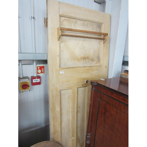 2092 - A reclaimed pine door with rail fitted to back, 27.5