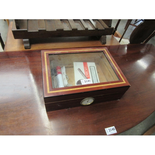 2141 - A mahogany inlaid cigar display cabinet