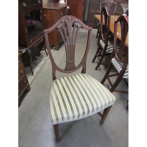 2152 - A set of Hepplewhite style dining chairs; six and two carvers with green velour stripe upholstery Pr... 