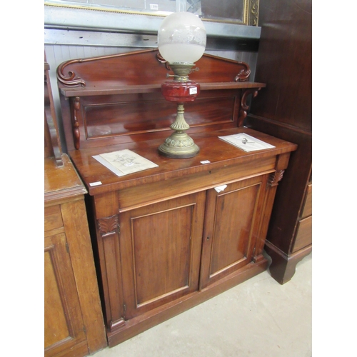 2182 - A Victorian mahogany chiffonier, the raised shelved back over a frieze drawer and two door cupboard,... 