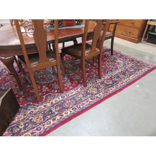 2193 - A blue and red wool rug 308 x 196cm