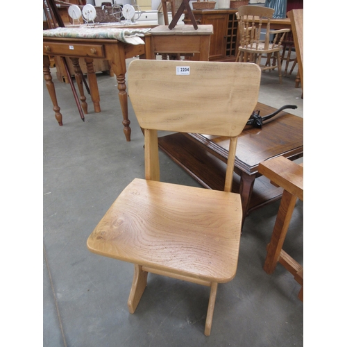 2204 - Two Mid century light oak chairs