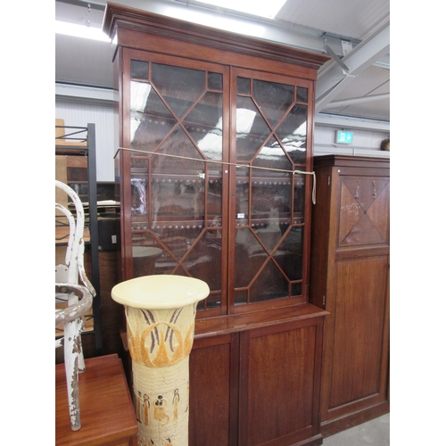 2276 - An Edwardian mahogany bookcase on cupboard base