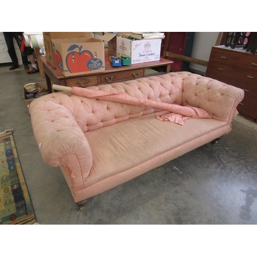 2297 - A Victorian pink upholstered Chesterfield sofa