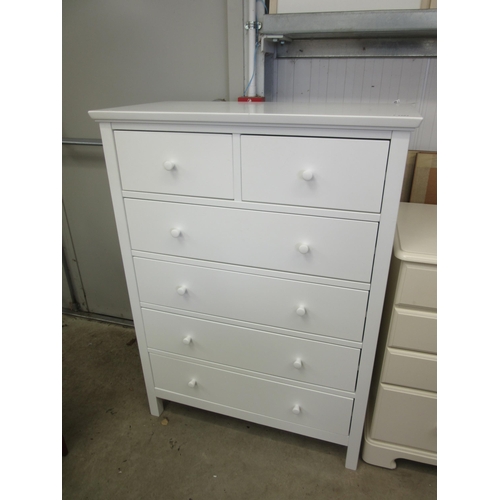 2307 - A modern white chest of two short over four long drawers