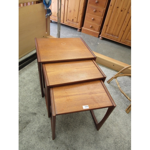 2355 - A nest of three 1970's teak tables