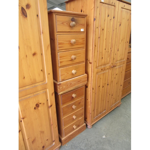 2361 - A pair of modern pine chests of four drawers, bun handles, plinth base