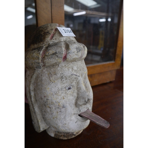 2104 - A 19th century Burmese carved wooden puppet head with sticky out tounge